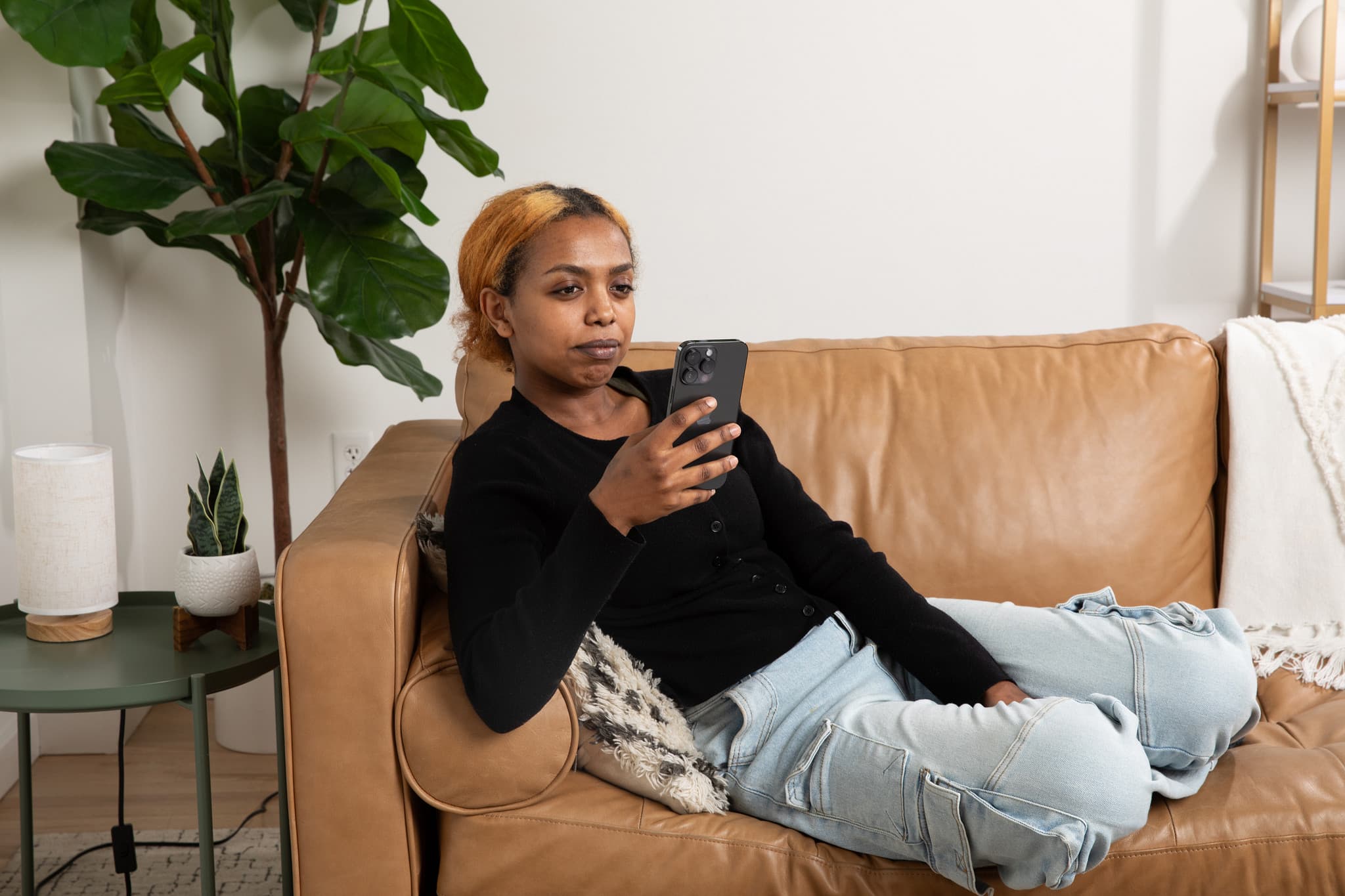 Girl on couch on phone Girl on couch on phone